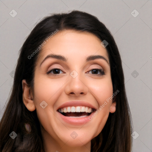 Joyful white young-adult female with long  black hair and brown eyes