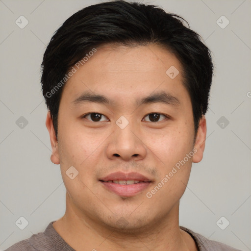 Joyful asian young-adult male with short  brown hair and brown eyes