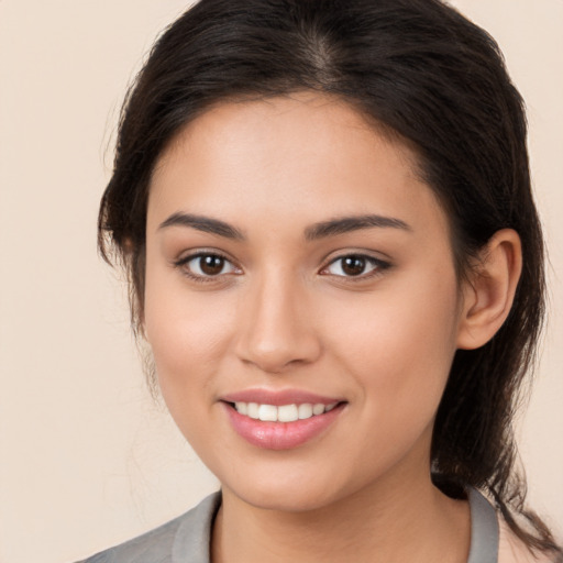 Joyful white young-adult female with medium  brown hair and brown eyes