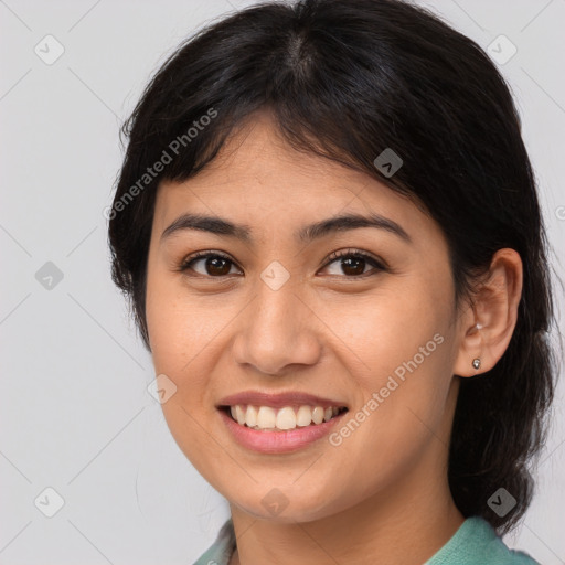 Joyful asian young-adult female with medium  brown hair and brown eyes