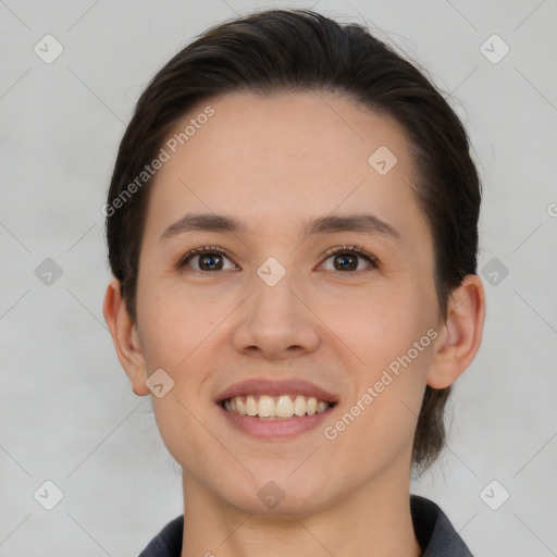 Joyful white young-adult female with short  brown hair and brown eyes