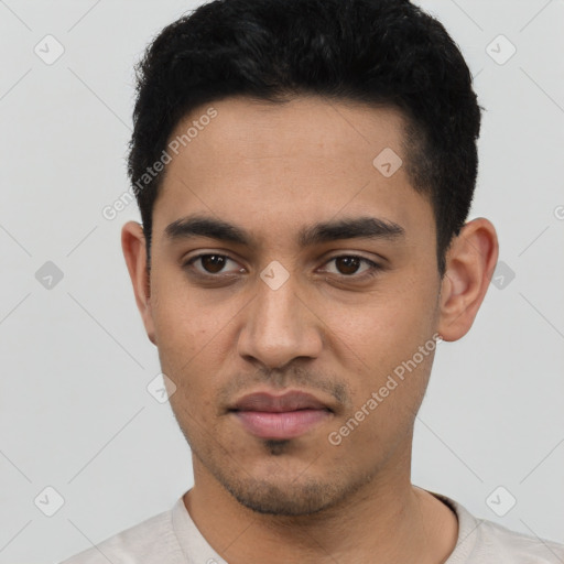 Neutral latino young-adult male with short  black hair and brown eyes