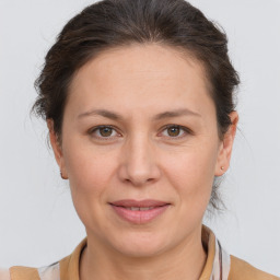 Joyful white adult female with short  brown hair and brown eyes