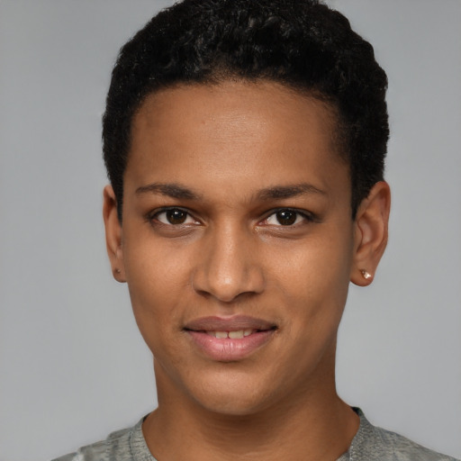 Joyful black young-adult female with short  black hair and brown eyes