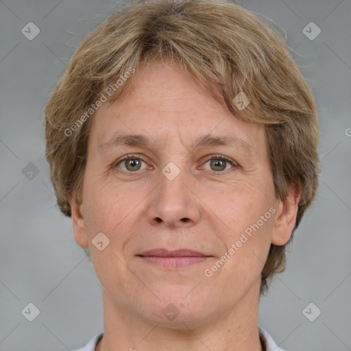 Joyful white adult female with short  brown hair and grey eyes