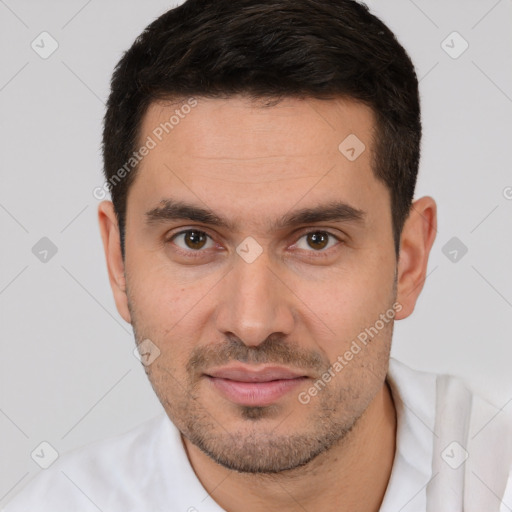 Joyful white young-adult male with short  brown hair and brown eyes