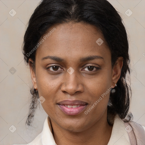 Joyful black adult female with medium  brown hair and brown eyes