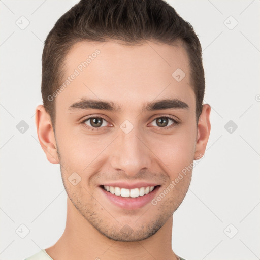 Joyful white young-adult male with short  brown hair and brown eyes