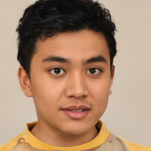Joyful latino young-adult male with short  brown hair and brown eyes