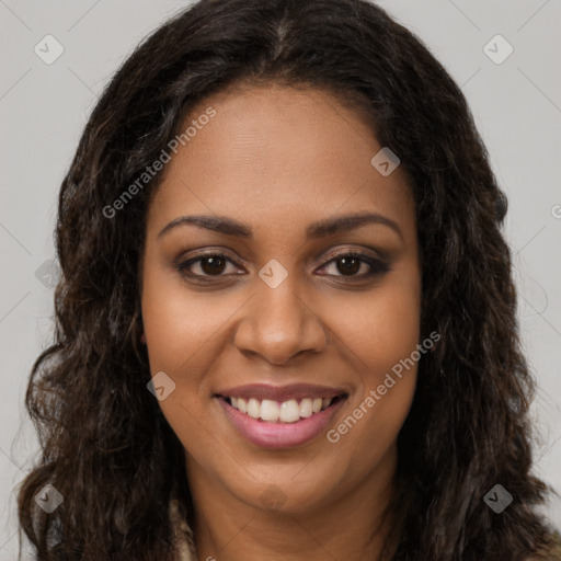 Joyful black young-adult female with long  brown hair and brown eyes