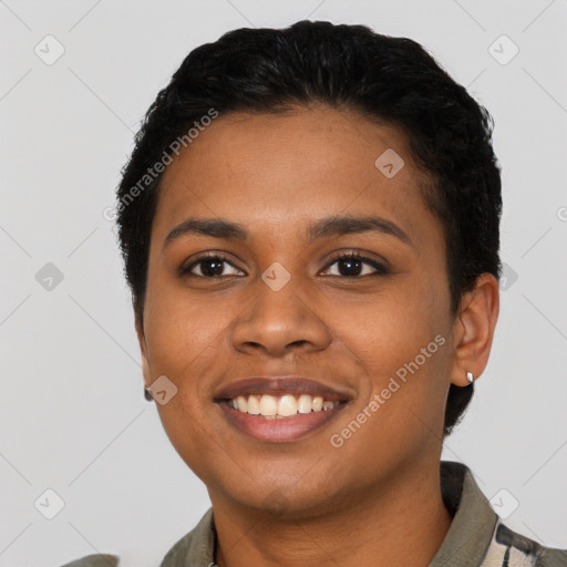 Joyful latino young-adult female with short  black hair and brown eyes