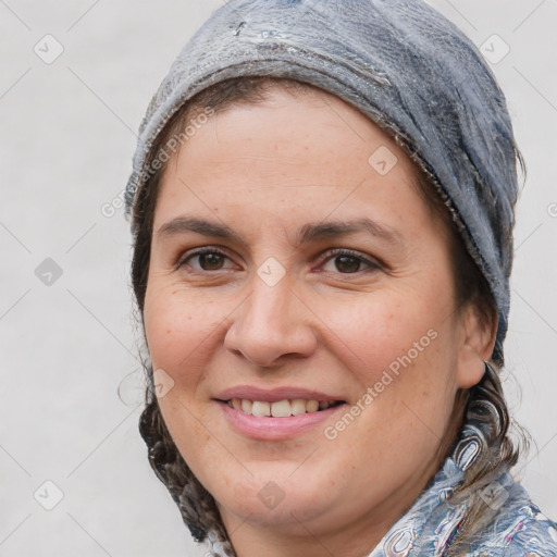 Joyful white adult female with medium  brown hair and brown eyes