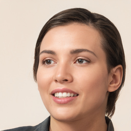 Joyful white young-adult female with medium  brown hair and brown eyes