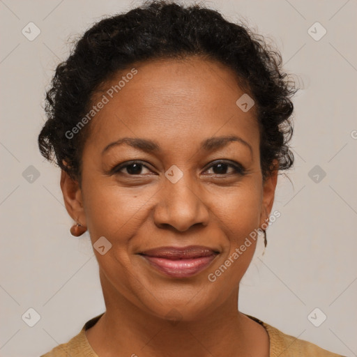 Joyful black adult female with short  brown hair and brown eyes