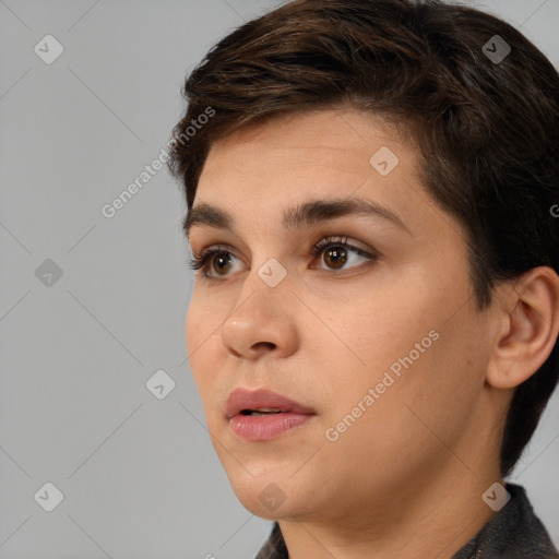 Joyful white young-adult female with short  brown hair and brown eyes