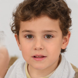 Joyful white child male with short  brown hair and brown eyes