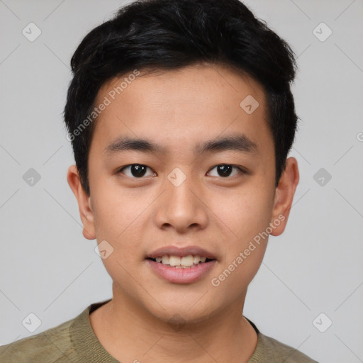 Joyful asian young-adult male with short  black hair and brown eyes