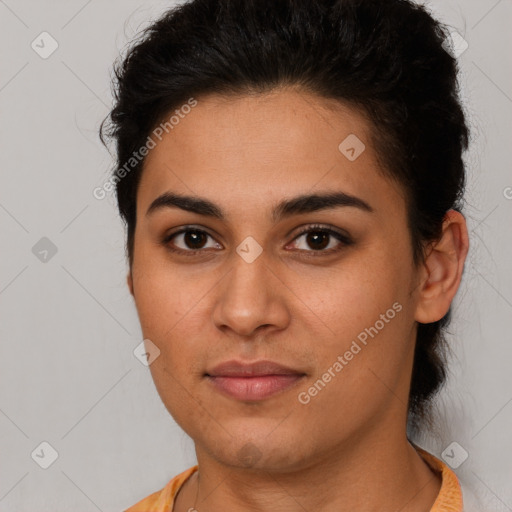 Joyful latino young-adult female with short  brown hair and brown eyes