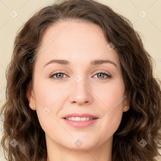 Joyful white young-adult female with long  brown hair and green eyes