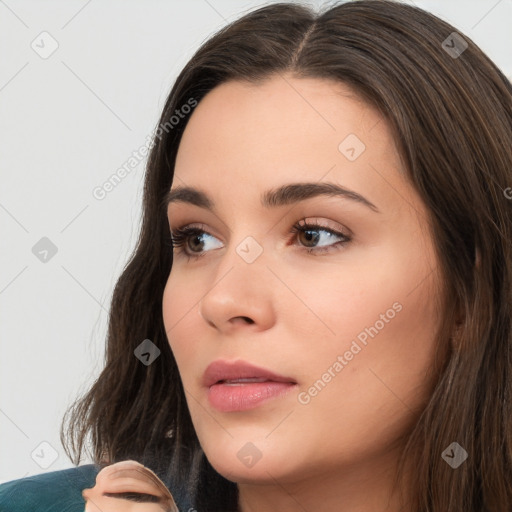 Neutral white young-adult female with long  brown hair and brown eyes