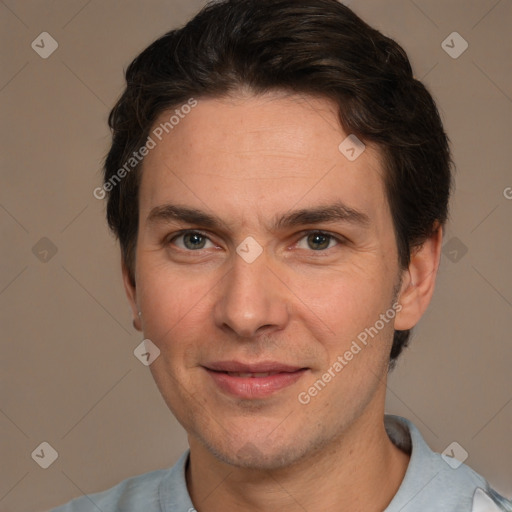 Joyful white adult male with short  brown hair and brown eyes