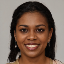 Joyful black young-adult female with medium  brown hair and brown eyes