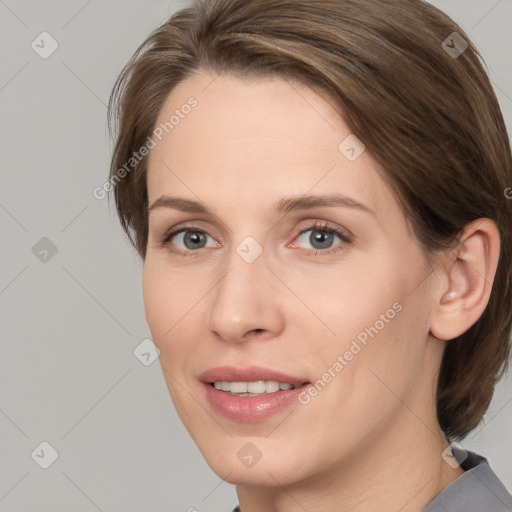 Joyful white adult female with medium  brown hair and grey eyes