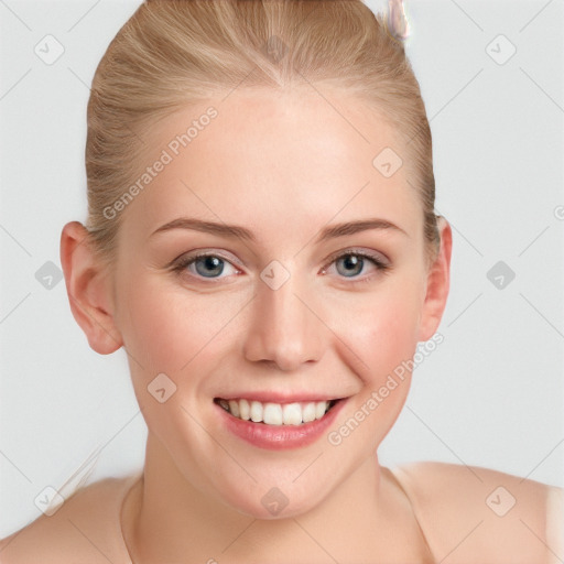 Joyful white young-adult female with short  brown hair and blue eyes