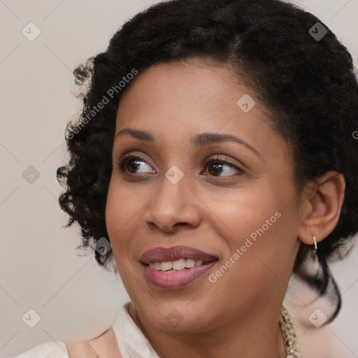 Joyful black young-adult female with medium  brown hair and brown eyes