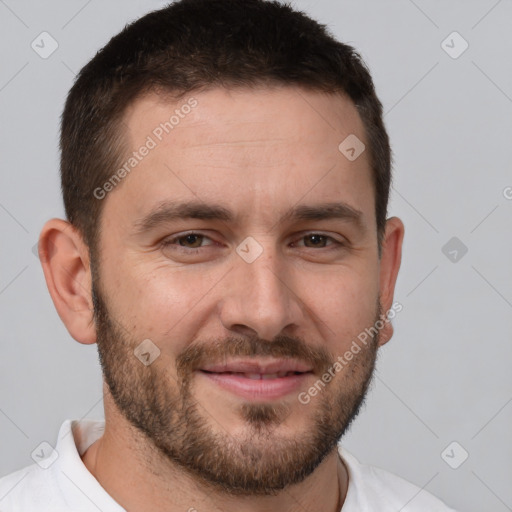 Joyful white adult male with short  brown hair and brown eyes