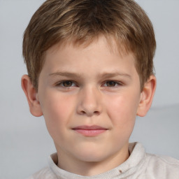 Joyful white child male with short  brown hair and brown eyes