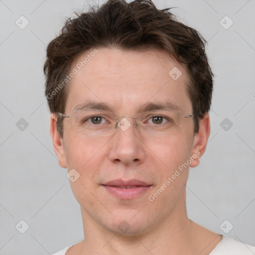 Joyful white adult male with short  brown hair and grey eyes