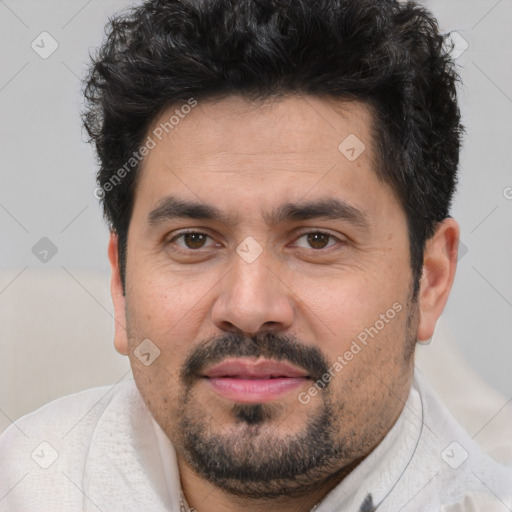 Joyful white adult male with short  black hair and brown eyes