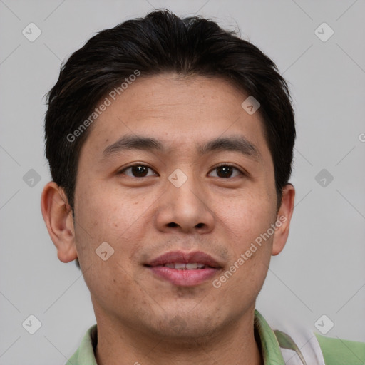 Joyful asian young-adult male with short  brown hair and brown eyes