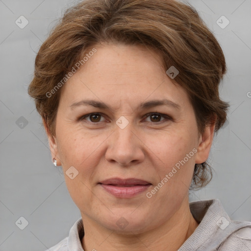 Joyful white adult female with short  brown hair and brown eyes