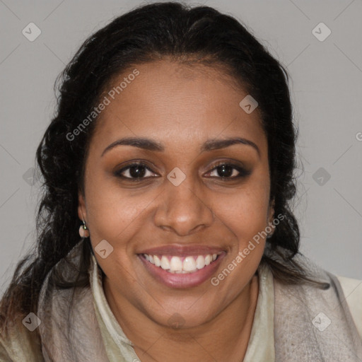 Joyful black young-adult female with long  brown hair and brown eyes
