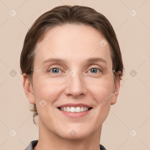 Joyful white young-adult female with short  brown hair and grey eyes