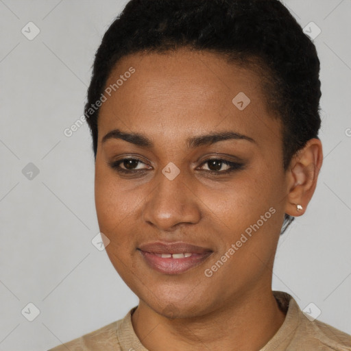 Joyful black young-adult female with short  black hair and brown eyes