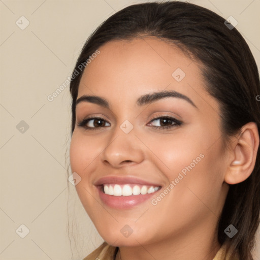 Joyful white young-adult female with long  brown hair and brown eyes