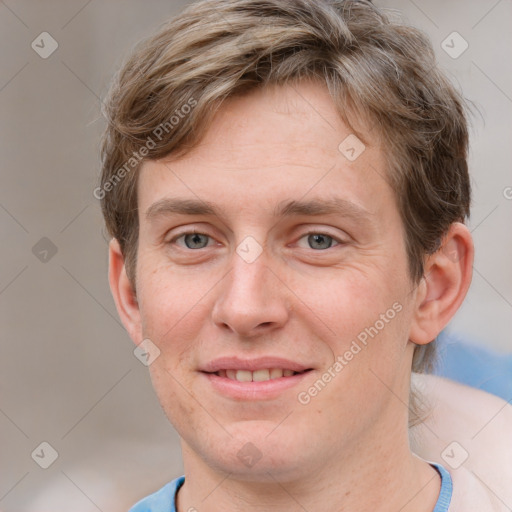 Joyful white adult male with short  brown hair and grey eyes