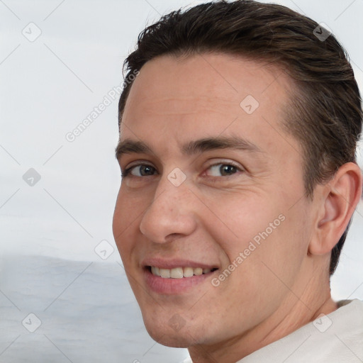 Joyful white adult male with short  brown hair and brown eyes