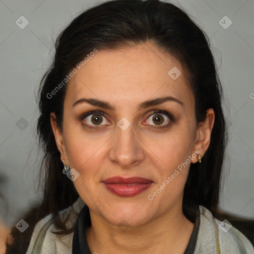 Joyful white adult female with long  brown hair and brown eyes