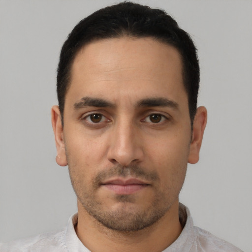 Neutral white young-adult male with short  black hair and brown eyes