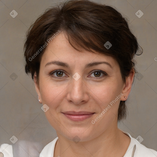 Joyful white adult female with medium  brown hair and brown eyes