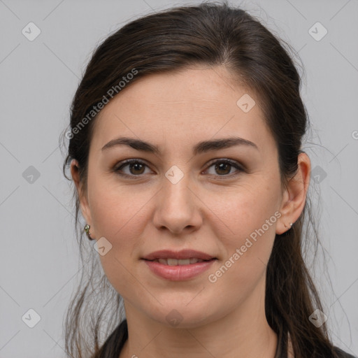 Joyful white young-adult female with long  brown hair and brown eyes