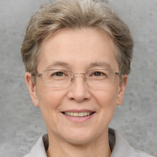 Joyful white middle-aged female with short  brown hair and grey eyes