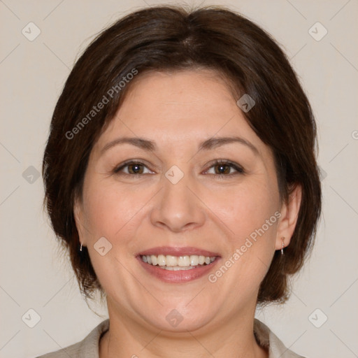 Joyful white adult female with medium  brown hair and brown eyes