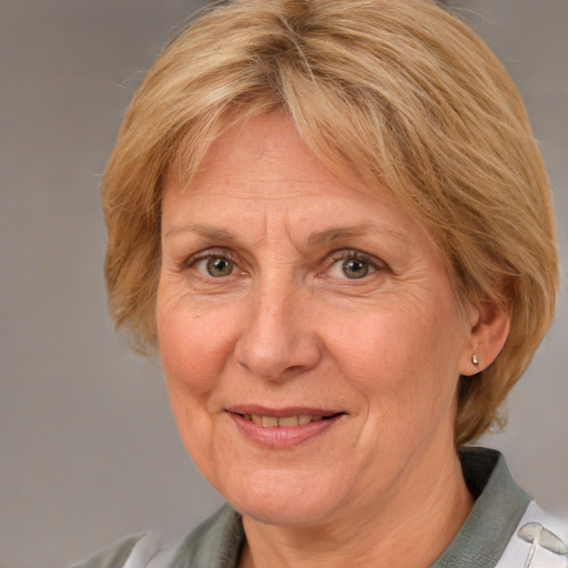 Joyful white middle-aged female with medium  brown hair and blue eyes