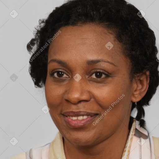 Joyful black adult female with short  brown hair and brown eyes