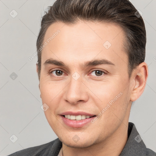 Joyful white young-adult male with short  brown hair and brown eyes